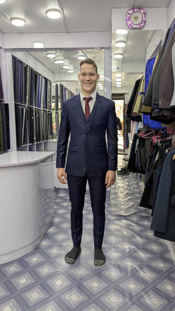A tourist image , who make a custom made suit in The Designer Tailors and - Happy customer
